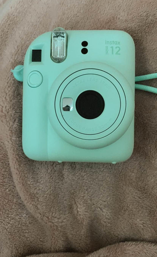 Light green Instax mini 12 camera